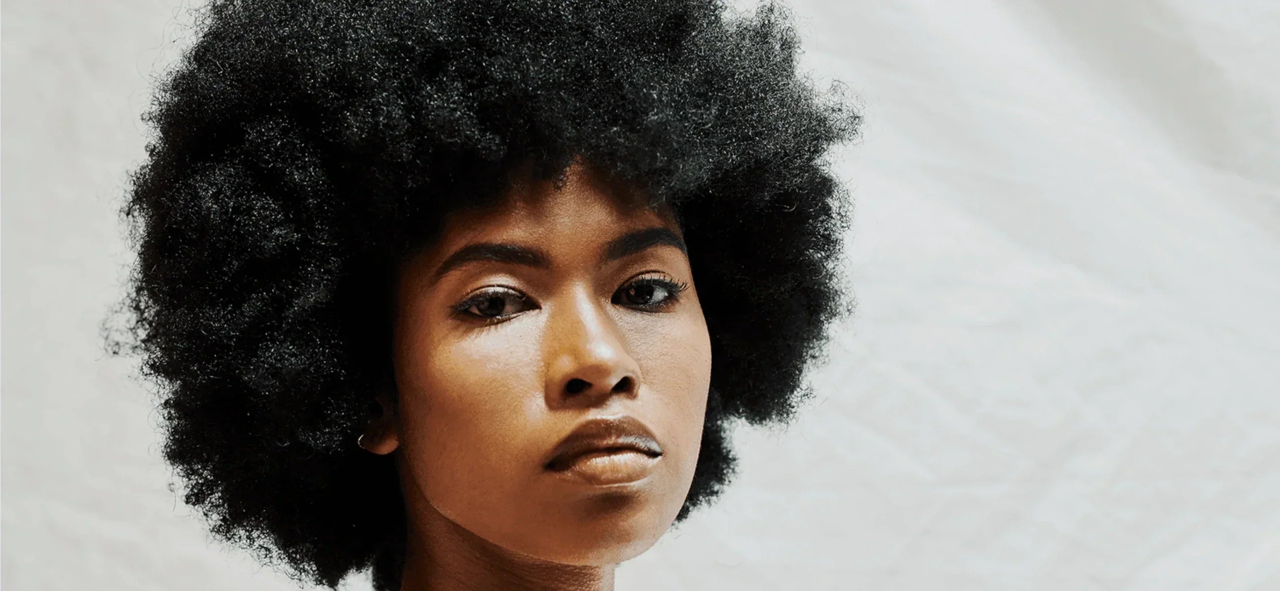 Everything you need to know about coily hair and how to maintain it