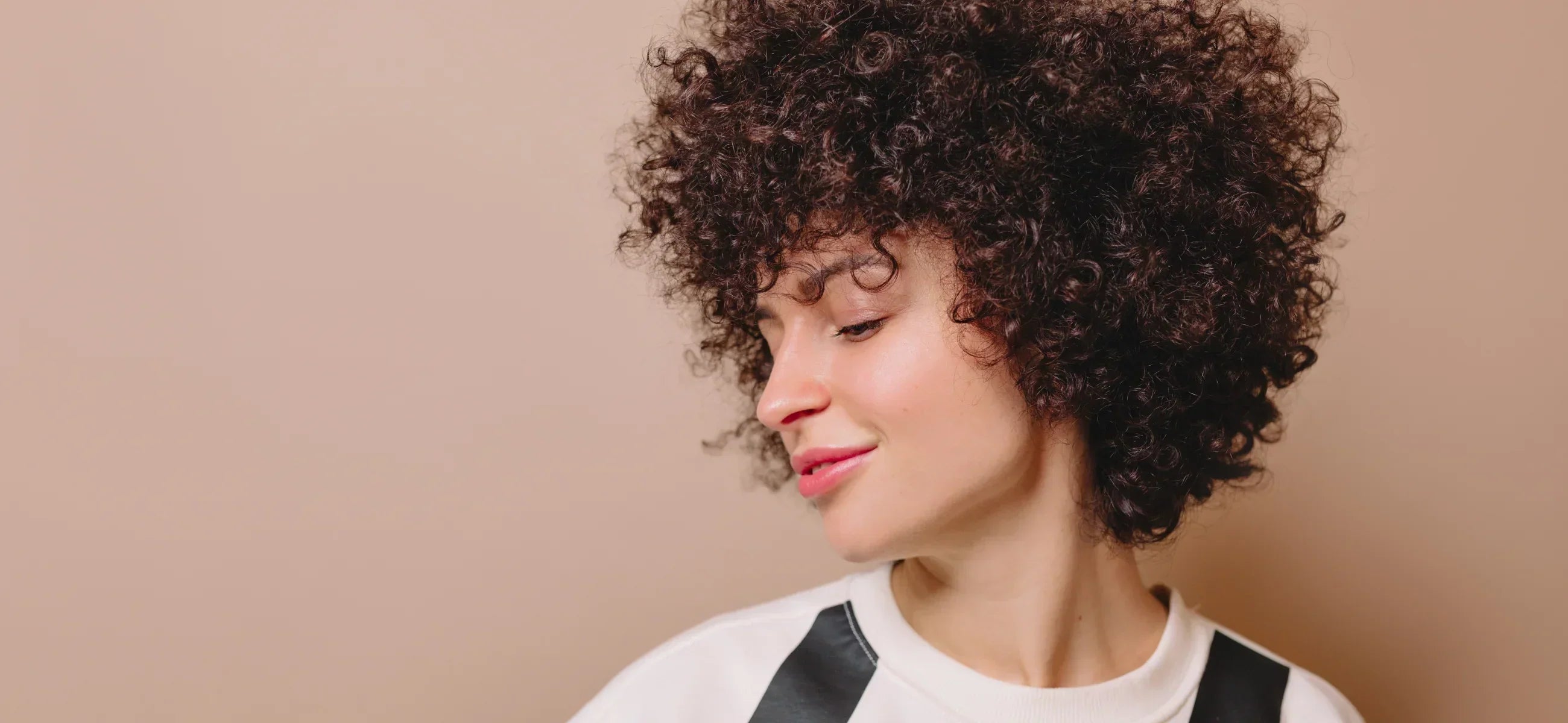 10 best 80s hairstyles in 2025, from rockstar mullets to voluminous curls