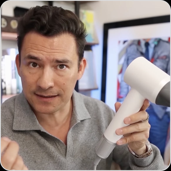 A man is introducing Laifen high-speed blow dryer